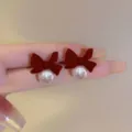 Elegant red flocked bow stud earrings with white pearl detail, French style variant - Bowknot Pearl Stud Earrings (E3617) / Red