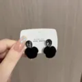Elegant black velvet rose stud earrings with teardrop dark grey gemstone accents. - Rose Rhinestone Stud Earrings (E3622) / Silver Plated Black