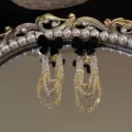 Elegant French style black velvet bow drop earrings featuring tiered sparkling rhinestone chains - Bowknot Rhinestone Tassel Style (E3724) / Black