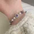 Close-up of elegant purple square zircon pearl bracelet worn on a model's wrist - Square Sugar Gem Style (R1510) / Purple