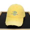 Detailed view of yellow distressed baseball cap featuring blue 1989 letter embroidery design - Adult 56-60cm / Yellow