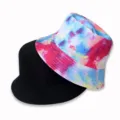 Detailed view of reversible bucket hats, featuring solid black and colorful tie-dye patterns. - Adult Size 55-58cm / Bright Rainbow Tie-Dye Style (8)