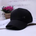 Stylish black unisex baseball cap featuring a metallic M logo, hip-hop style sun hat - Adjustable / Black