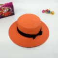 Stylish orange flat top straw hat with black bow, perfect summer beach sun protection. - M (56-58cm) / Orange