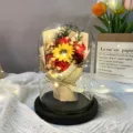 Detailed macro shot of soap flower bouquet in a glass dome with LED string lights - Large Glass Dome / Red