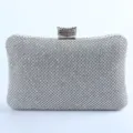 Stunning silver rhinestone evening clutch bag with metal clasp, perfect for parties and weddings. - Silver