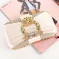 Elegant champagne pleated evening clutch bag featuring a luxurious rhinestone buckle detail - Gold
