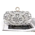 Elegant silver beaded evening clutch bag featuring sparkling crystals and a ring top clasp - Silver