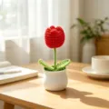 Macro view showing the detailed texture of a handmade red crochet tulip in a white pot - Single Head Tulip - Red