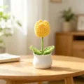 Detailed macro view of a handmade yellow crochet tulip potted plant on wooden table - Single Head Tulip - Yellow