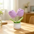 Detail of handmade crochet purple tulip potted plant in a white pot for desktop decor - Double Head Tulip - Purple