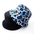 Reversible bucket hat detail showing blue leopard print and solid black sides for casual wear. - Adult 55-58cm / Blue Leopard Print