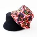 Reversible bucket hat with vibrant digital print and solid black side for outdoor casual wear. - Style 10
