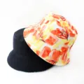 Detailed view of reversible bucket hat showing art print and solid black design textures. - Style 15