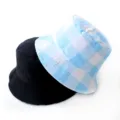 Detailed view of a solid black bucket hat and a light blue checkered patterned bucket hat. - Adult 55-58cm / Checkerboard Sky Blue