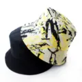 Close-up detail of reversible bucket hat, black and yellow graffiti design, sun protection. - Adult 55-58cm / Graffiti Yellow