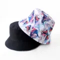 Reversible bucket hat with colorful fluid print and solid black side for outdoor casual use. - Style 38