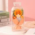 Detailed macro view of handmade knitted sunflower bouquet in a transparent PVC gift box - Orange Style (Hand-Carried Box)
