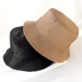 Detailed view of the trendy double-sided bucket hat, stylish sun protection for women. - Adult 55-58cm / Black and Khaki