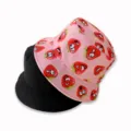 Reversible bucket hat with cute strawberry print and classic black side for women. - Strawberry Deep Pink