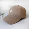Macro view of khaki cotton baseball cap with a white embroidered letter R on front - Adult 55-58cm / Khaki