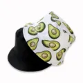 Reversible bucket hat with cute avocado print and solid black side for versatile styling. - Avocado White