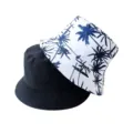 Vue détaillée du chapeau bob réversible avec impression de palmier et design noir uni. - Adulte 55-58cm / Blanc avec Cocotier