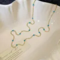 Elegant gold-plated beaded necklace featuring turquoise blue accent beads for women - Beaded Necklace