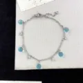 Dainty silver star chain bracelet featuring ice-blue crystal balls and sparkling zircons - Blue Style (R0531)