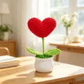Close-up detail of handmade red heart-shaped crochet flower potted plant ornament - Heart-Shaped Potted Plant - Red