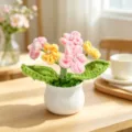 Detailed view of handmade crochet flowers in white pot, decorative knitted plant for gift - 5-Head Gypsophila / Pink & Yellow