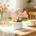 Handmade crochet flower pot ornament with pink yarn blossoms and white ceramic base - 5-Head Forget-me-not Potted Plant / Pink Gradient