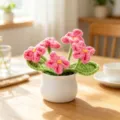 Handmade crochet potted plant with five pink yarn flowers in a white ceramic pot - 5-Head Forget-me-not Potted Plant / Rose Red