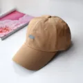 Detailed view of a khaki soft-top baseball cap with blue 'BOOK' embroidery on white. - Adult Adjustable 55-59cm / BOOK Khaki