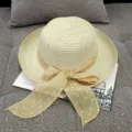 Elegant women's summer straw sun hat featuring a wide brim and a charming polka dot bow ribbon - M (56-58cm) / Hemp Bow Ribbon Beige