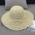 Handwoven beige straw sun hat with large brim and delicate bow for summer beach vacation - M (56-58cm) / Handmade crochet beige