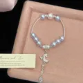 Elegante bracciale di perle viola con ciondolo a mezzaluna di strass e farfalla lusso - Stile Luna Lavanda (R5229) / Viola Lavanda