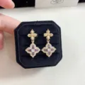 Detailed macro shot of vintage gold floral earrings set with purple and white stones. - Four-leaf Flower Stud Earrings (R5116)