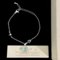 Dainty silver-colored chain bracelet with a sparkling light blue star zircon pendant - Blue Star Bracelet (R2092)