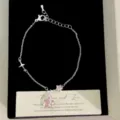 Exquisite silver-tone bracelet featuring pink cubic zirconia star charms in a gift box - Pink Star Bracelet (R2093)