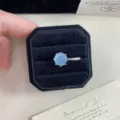 Detail view of a light blue rose cut crystal ring inside a black velvet gift box - 1 Piece / Blue Rose Cut (R0462)
