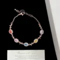 Pulsera ajustable de oro rosa con circonitas de colores corte hielo y lazos elegantes - Estilo de Lazo Oro Rosa (R1315)