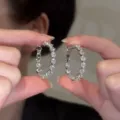 Grandi orecchini a cerchio in argento scintillanti con pietre chiare per donna - Stile Strass Completo / Argento