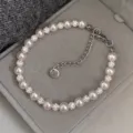 Bracelet élégant en perles roses avec perles pavées de cristaux sur velours gris - Bracelet Manta en Boule de Strass (R0343)