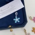 Elegant sparkling silver daisy flower pendant with blue cubic zirconia in a dark blue jewelry box - Blue Pendant Only (Without Chain) / Silver