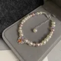 Elegant pearl and purple crystal bracelet with silver-tone butterfly charm. - Orange Butterfly Style (R1408) / Orange