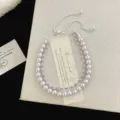 Bracciale a doppio strato con perle rosa e zirconi viola, chiusura regolabile - Braccialetto a Doppio Strato Manta (R0683) / Viola
