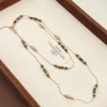 Close-up detail of vintage double-layered necklace with natural tiger eye beads and pearls - Cylindrical Bead Pearl Double Layer Necklace (R4062)