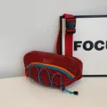 Sporty red corduroy waist bag with white dots and colorful blue bungee cord detail - One Size / Red