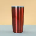 Detailed view of the 20oz stainless steel vacuum insulated tumbler with metallic red finish. - 20oz / Red